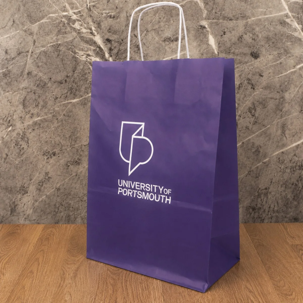 Personalised Purple University Of Portsmouth Printed Paper Bag With White Twisted Handles