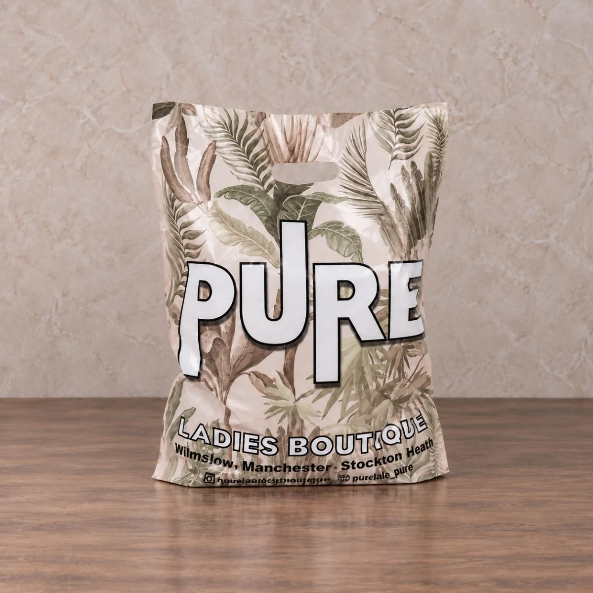 White PURE Ladies Boutique Printed Patch Handle Plastic Bag With Botanical Design