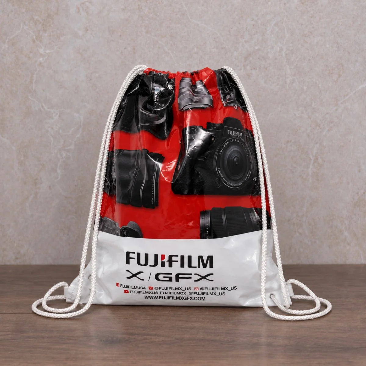 Red Black And White Fujifilm Printed Plastic Drawstring Bag With White Cord Handles Red Black And White Fujifilm Printed Plastic Drawstring Bag With White Cord Handles